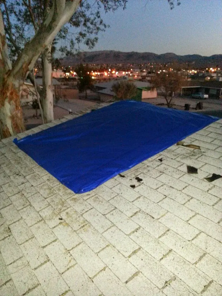 Professional board-up and tarp installation after garage fire in Twentynine Palms