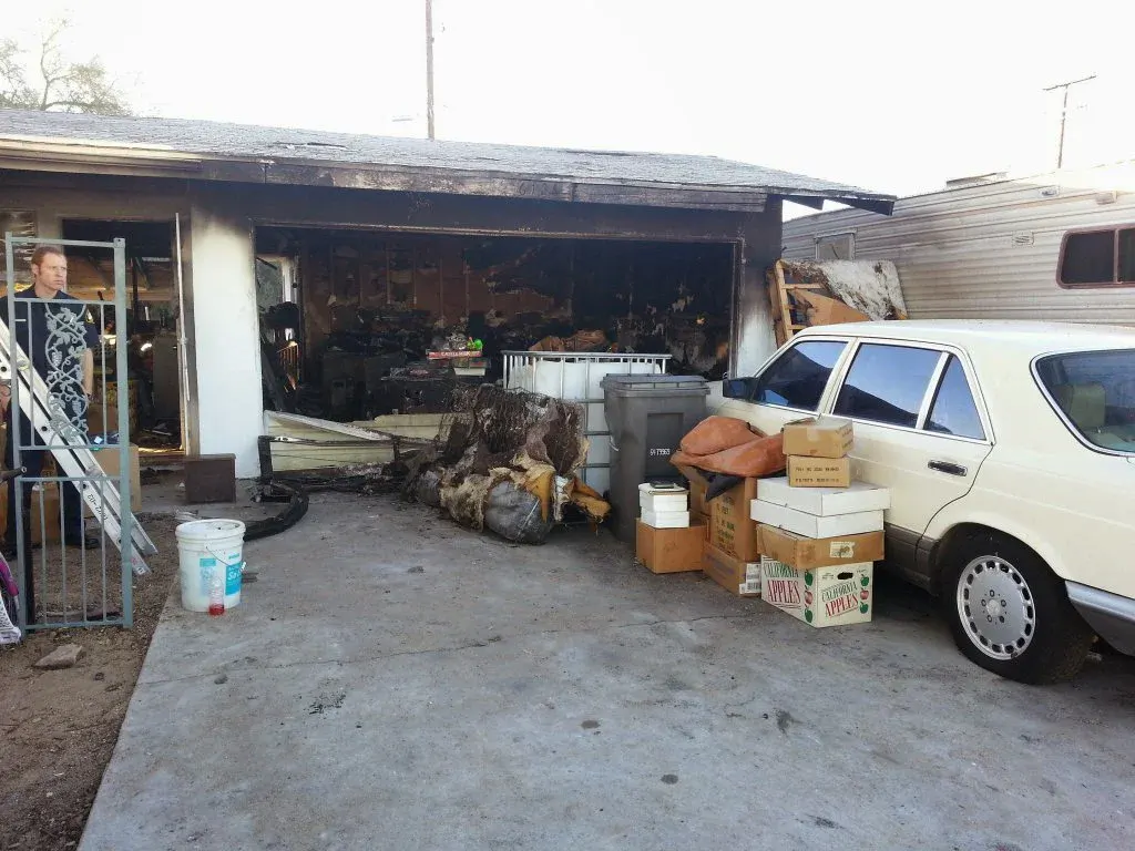 Before: Professional board-up and tarp installation after garage fire in Twentynine Palms