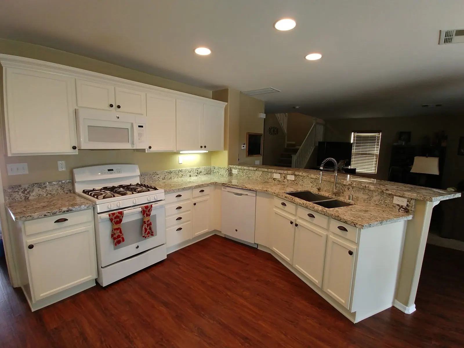 Moreno Valley dishwasher leak kitchen restoration showing cabinet repair, dry-down, rebuilt cabinets, and upgraded granite counters