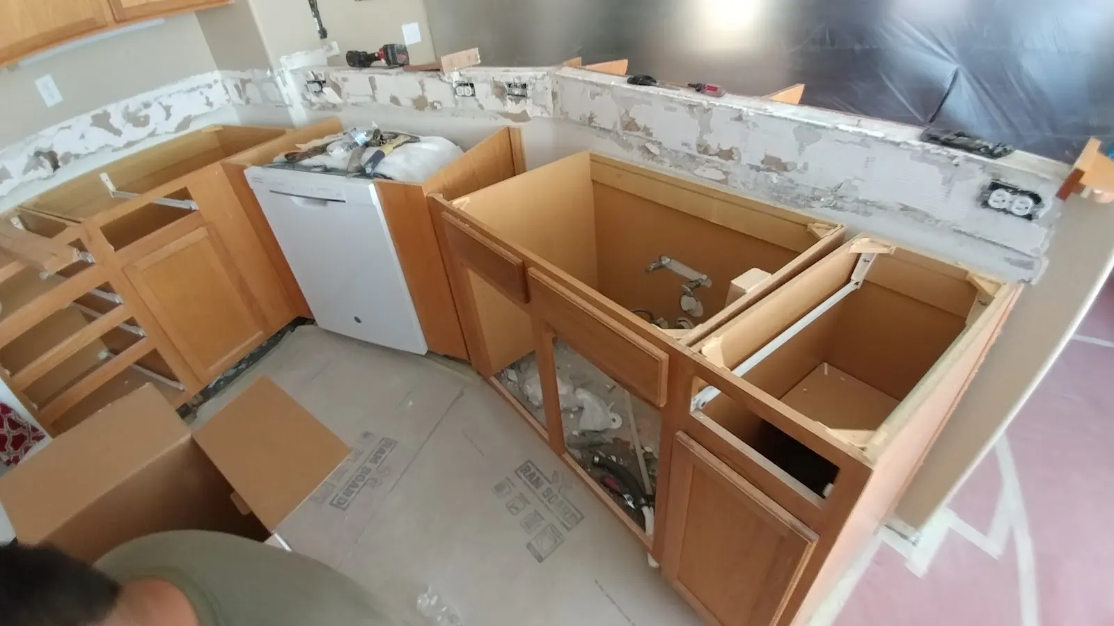 Before: Moreno Valley dishwasher leak kitchen restoration showing cabinet repair, dry-down, rebuilt cabinets, and upgraded granite counters
