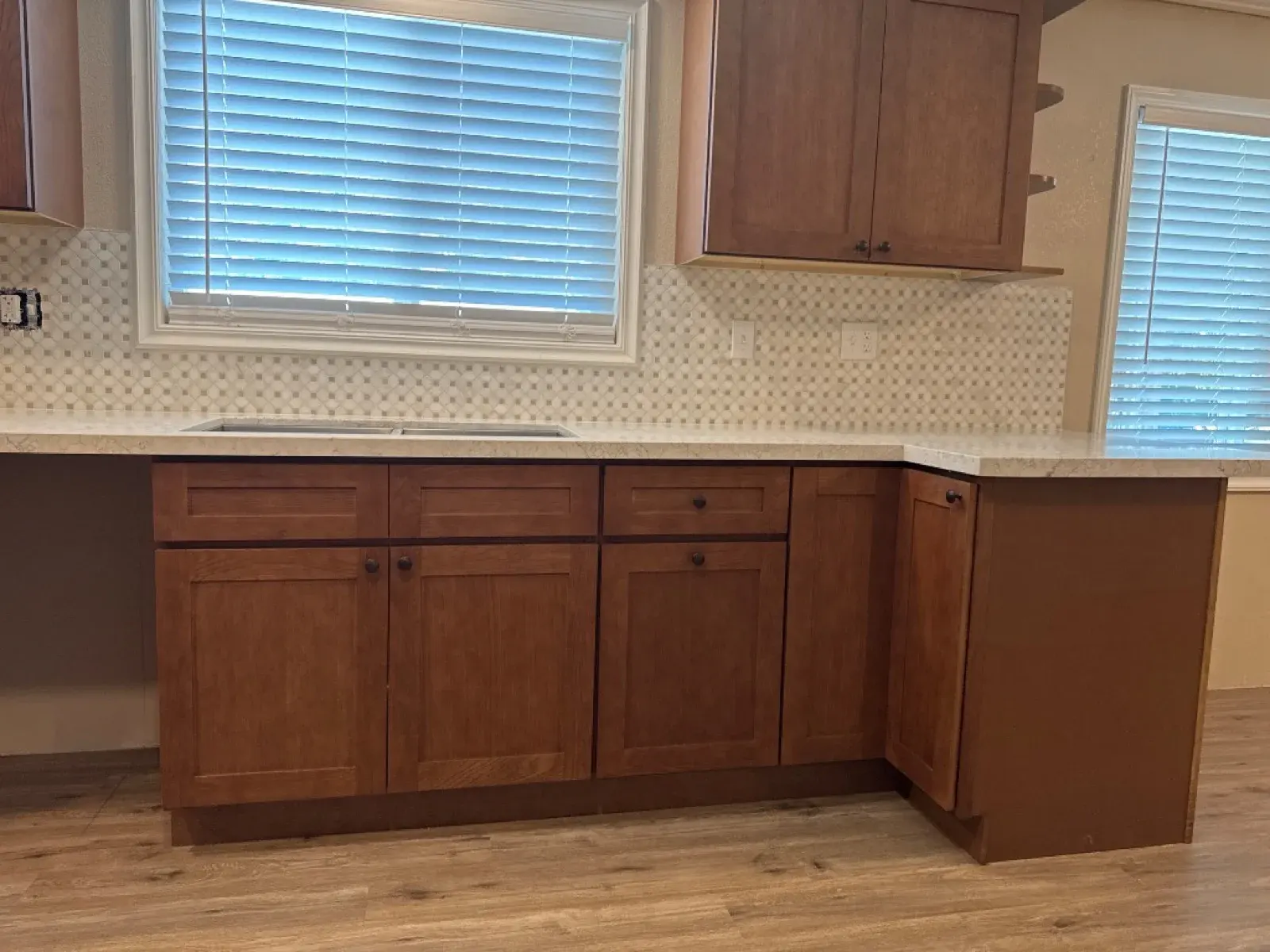 Kitchen cabinets and Calacatta Pietra quartz with MSI Bianco Dolomite Cream Dotty backsplash — Reflection Lake, San Jacinto, CA — PL Builders