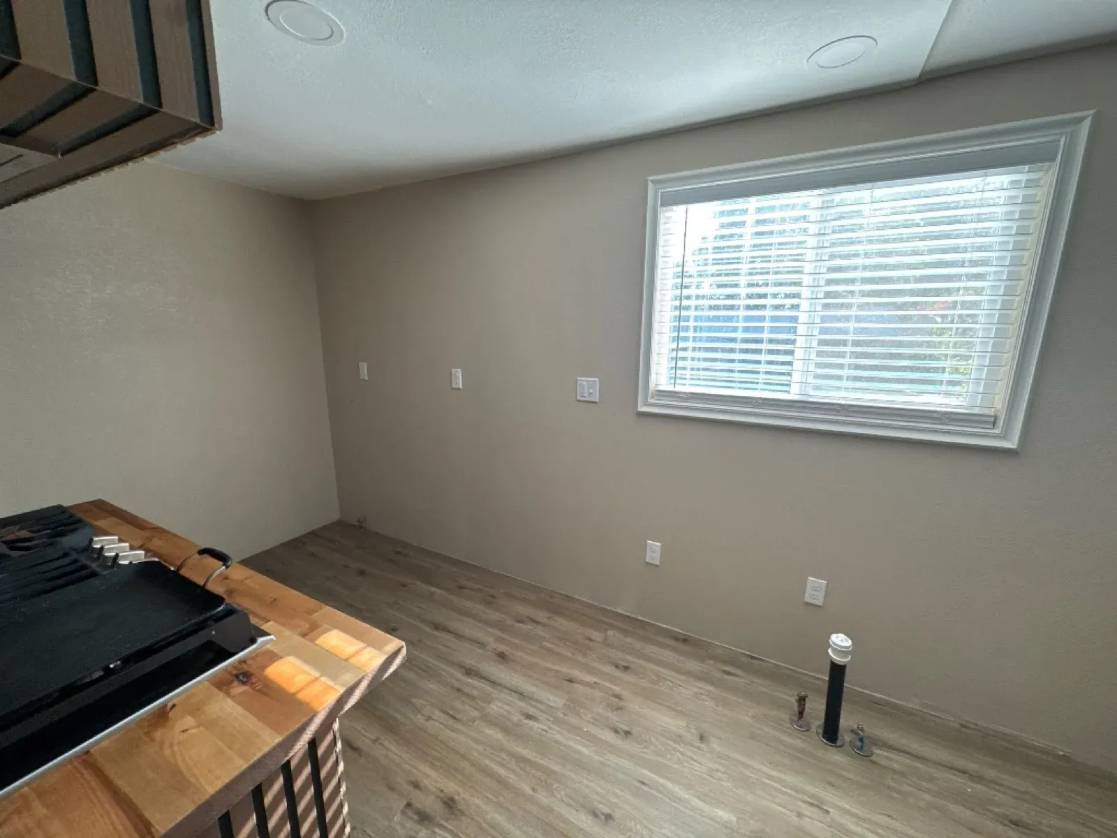 Before: Kitchen cabinets and Calacatta Pietra quartz with MSI Bianco Dolomite Cream Dotty backsplash — Reflection Lake, San Jacinto, CA — PL Builders