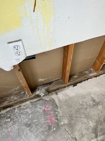 Kitchen cabinet and wall demolition after burst pipe water damage in San Jacinto